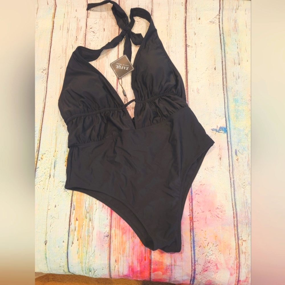Black one piece halter tie back also swimsuit